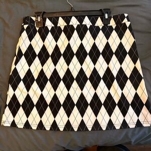 Arguile skirt. Side zip Stretchy. Feels like polyester. xl. 17”across waist.